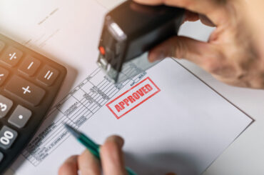 tender acceptance - hand put a approved stamp on financial bill