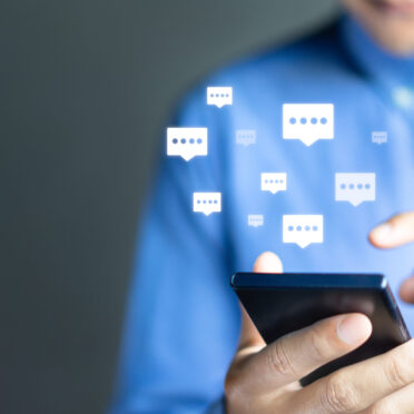 Live chat chatting and social network concepts, Close-up hands using mobile smartphone with chat box icons