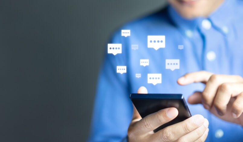 Live chat chatting and social network concepts, Close-up hands using mobile smartphone with chat box icons